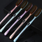 OEM ODM Factory Price Children's Toothbrush with Cute Clover Baffle Silicone Handle in Green Purple Soft Bristle Baby Toothbrush